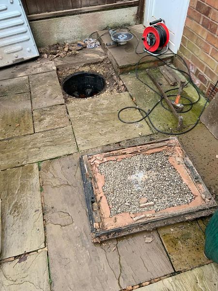 a hole in a concrete patio