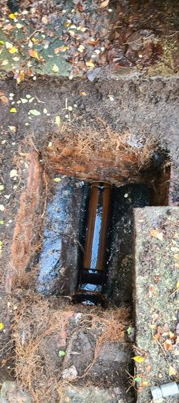 a pipe in a hole in the ground